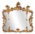 Carved and Gilded Wooden Mirror For Sale