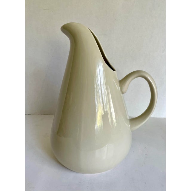 Here is a beautiful and sculptural pitcher designed by Russell Wright and produced by Oneida. This piece is inspired by...