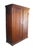 This antique wardrobe is a rustic, country-style armoire crafted from solid poplar wood, showcasing a warm, honey-toned...