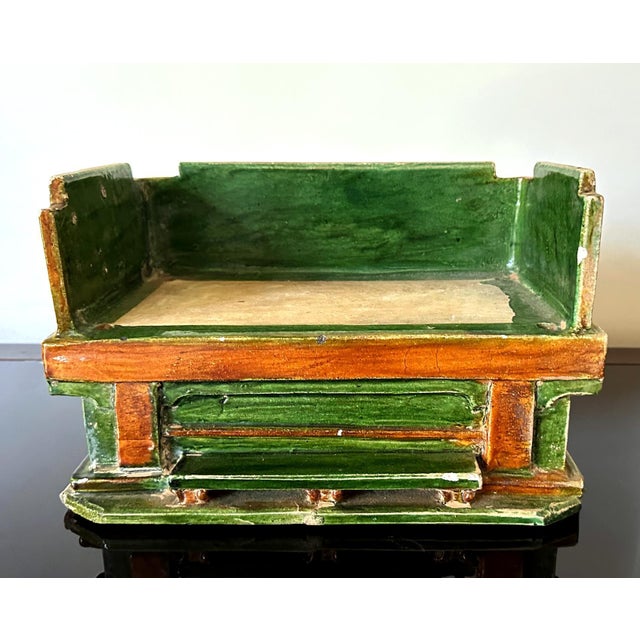 A Chinese stoneware day bed model circa Ming dynasty (15th-17th century). The miniature models were traditionally made as...