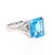 This beautiful Emerald cut Blue Topaz and Diamond ring has a stunningly large Blue Topaz that weighs 6.55 Carats. It is...