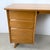 This mid-century modern student desk is attributed to Baumritter and reflects the practical elegance of late 1950s...