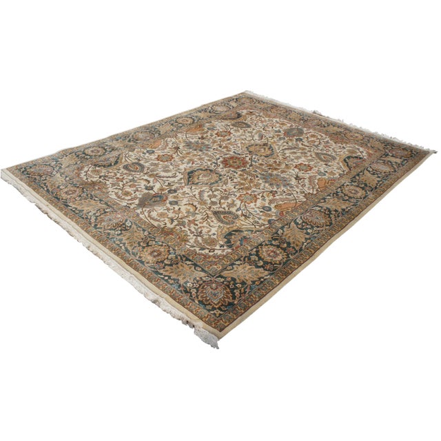 "Vintage Agra area rug. Features a field of beige or tan with a floral all over motif with reds, greens, blues, orange,...