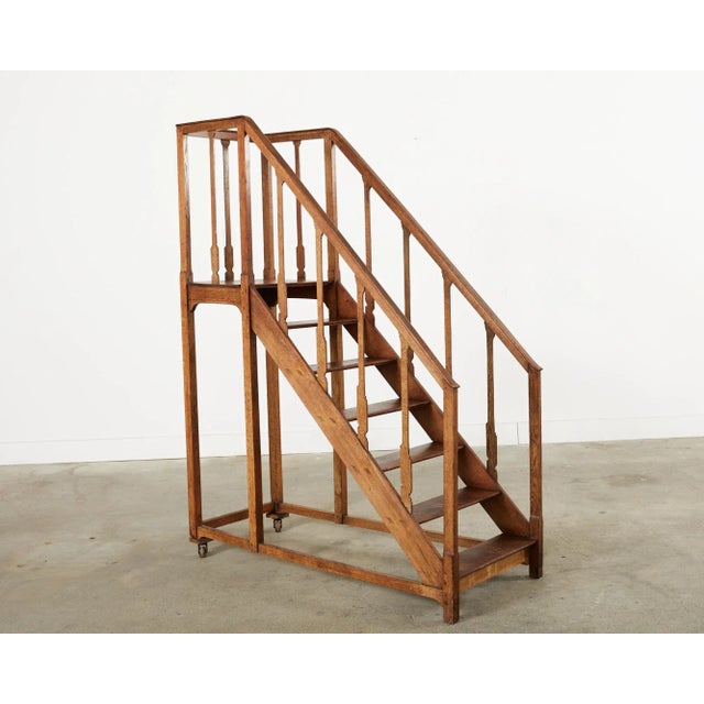 Early 20th century English arts and crafts period library steps, staircase, or ladder with handrails. The staircase...
