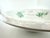 Antique French Digoin serving bowl featuring soft green floral transfers against warm ivory ironstone with beautiful age-...
