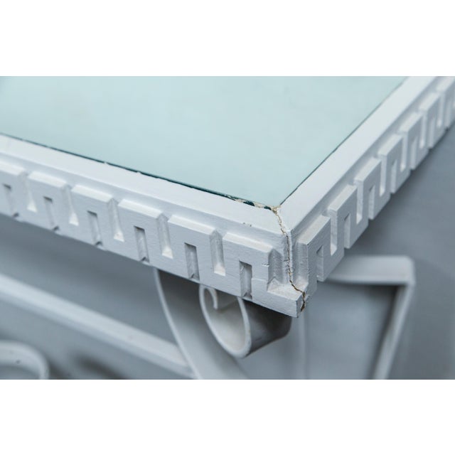 Heavy gauge wrought iron gives this console the weight and drama of a Dorothy Draper piece. Stylish tapered legs, each...