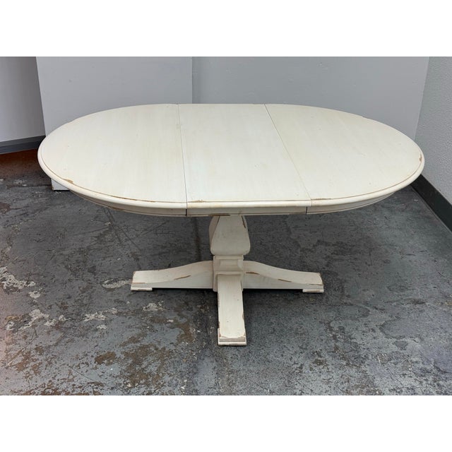 Design Plus Gallery presents the Cameron Extension Table from Ethan Allen. This round pedestal table has an antique ivory...