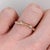 Four earth-mined diamonds run across this solid 14K yellow gold band. The hardest natural material, diamond has symbolised...