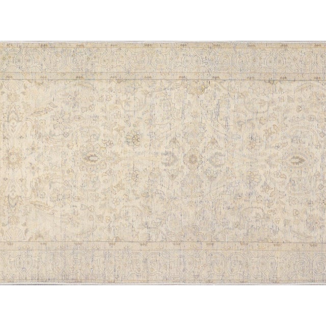 This vintage Persian Tabriz Runner is a stunning 2'5" x 9'4" slice of history. Crafted from wool on cotton, it's...