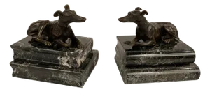 Pair of Regency Bronze Figures of Reclining Whippets on Green Marble Bases