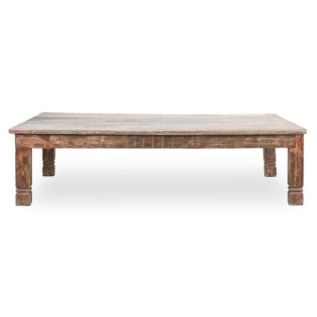 Magnificent coffee table in weathered wood. This unique piece will add a touch of rustic charm and authenticity to your...