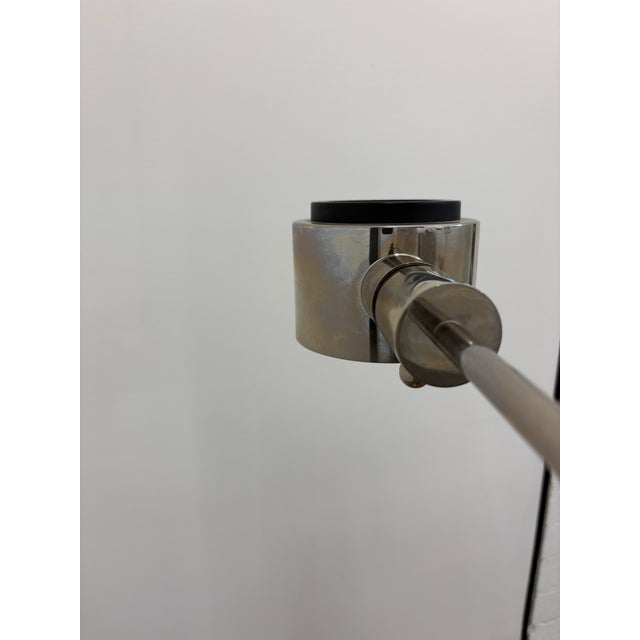 A rare and iconic vintage adjustable chrome floor lamp by renowned California-based Casella Lighting, known for their...