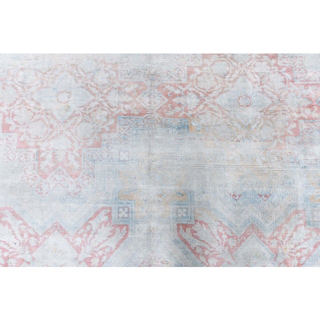 This dreamy 1920s Indian Agra rug features a delicate cotton pile that has mellowed into a soft, watercolor-like palette....