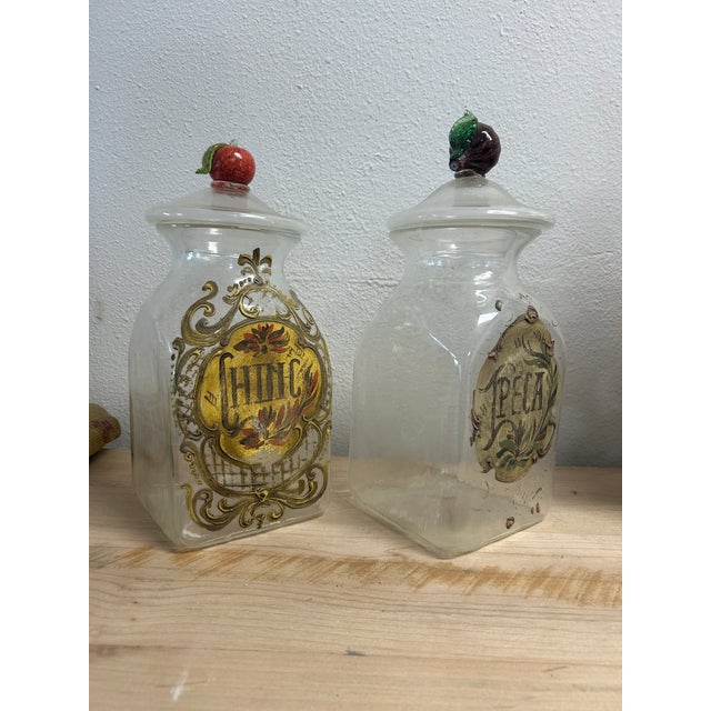 A wonderful pair of large antique Italian Murano glass pharmacy / apothecary canister with lid. Elaborately hand-painted...