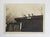 Early 20th century sepia snapshot photograph of boys on the roof of a ladies room. Unframed.