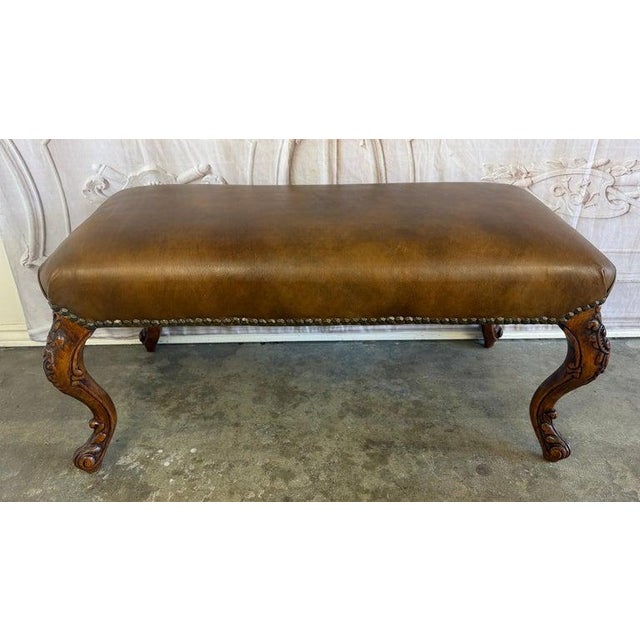 An exceptional vintage French Louis XV style bench, distinguished by its extraordinary hand-carved detail and luxurious...