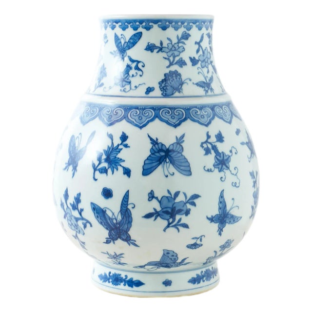 Blue and White Globular Vase with Butterflies and Floral Motifs For Sale