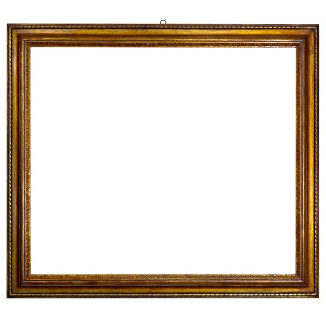 An imposing Italian hand-carved wooden picture frame dating from the 1980s, featuring richly articulated mouldings and a...