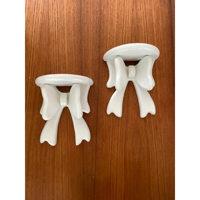 Vintage pair of painted wooden 3-D bow wall shelves / sconces from the late 80’s or 90’s. Great whimsical addition to...