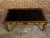 An English oak desk from the 19th century with ebonized accents, carved floral motifs and Greek Key frieze. This 19th-...