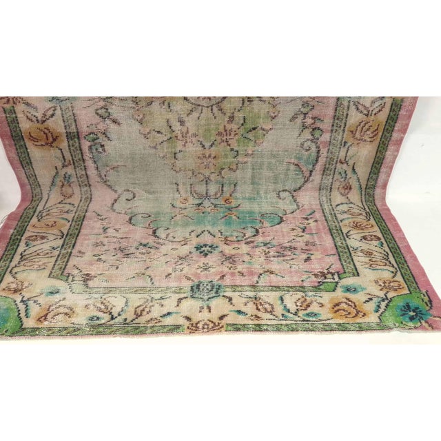 This vintage hand-knotted area rug is a semi-antique vintage area rug. The '70s Eastern Anatolian region's unique rug is...