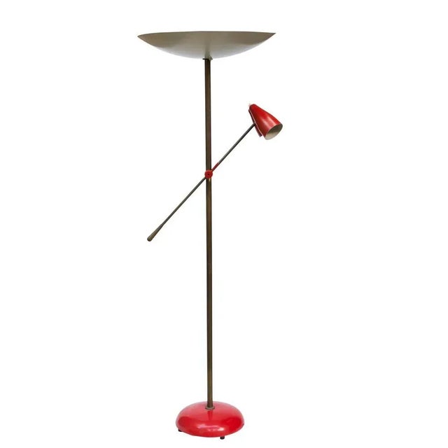 Rare floor lamp by Stilnovo , Patinated brass structure with two articulating lamp shades and arm. Original cream...