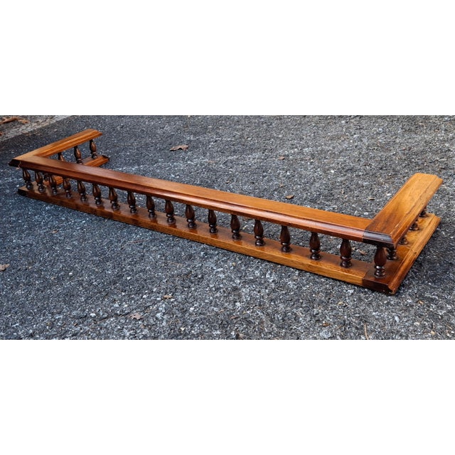 A Mid 20th Century Georgian Style Carved and Gallerried Mahogany Fireplace Fender. Dimensions: 41.5" in width, 11.5" in...