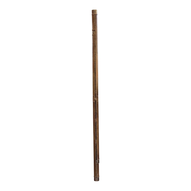 A British elephant ladder — a folding pole ladder wrapped in leather with double rows of brass studs and brass caps at the...