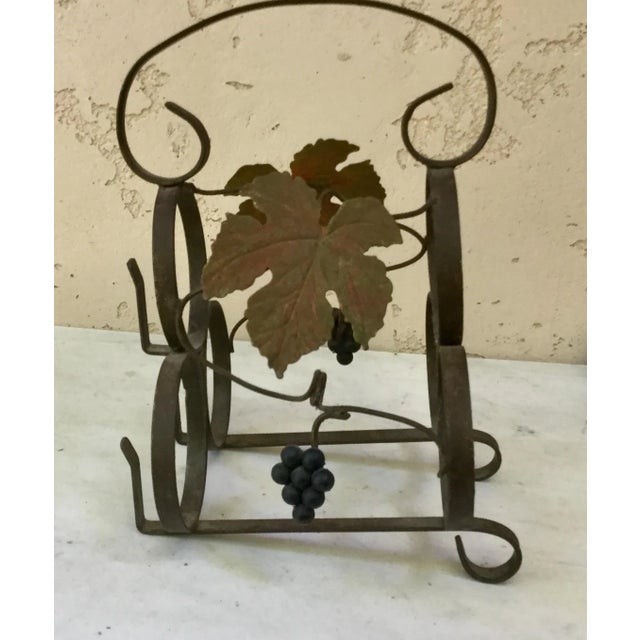 French iron wine bottle rack for 3 bottles decorated with grapes circa 1950.