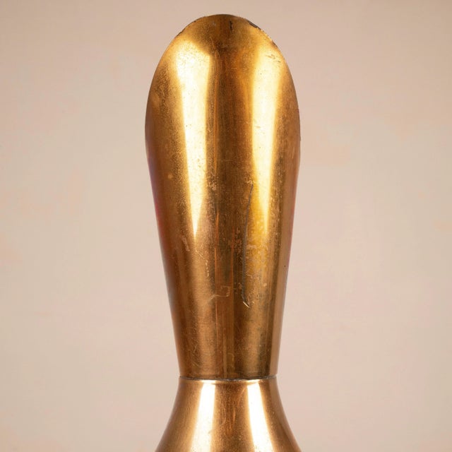 An elegant thermos by Aldo Tura, Milan, 1960s, crafted from fine gray parchment with gold-plated brass trim. The slender,...