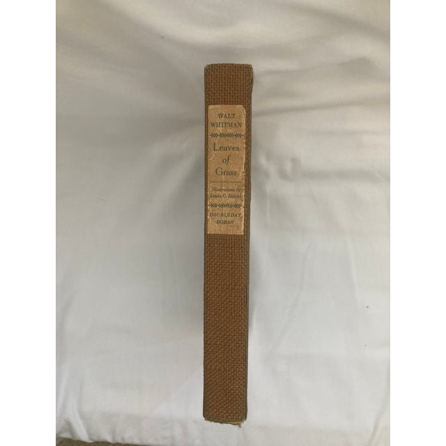 This is a 1940 illustrated edition of the landmark poetry collection by WALT WHITMAN. Originally self-published by Whitman...