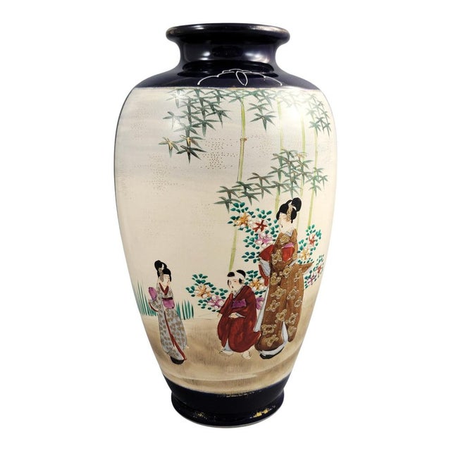 A large Japanese Satsuma display vase of elegant ovoid form, set against a deep cobalt-blue ground and reserved with...