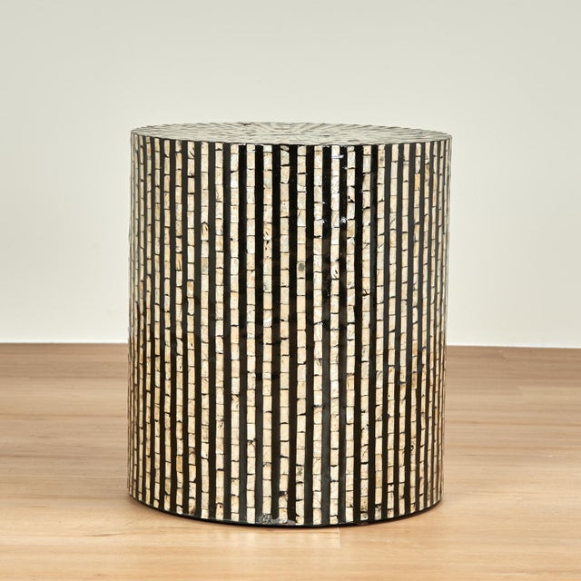 Eye catching mid century modern style stands crafted in a canister form and decorated with mother of pearl in an op art...