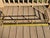 Antique brass fireplace fender with twisted rails and ball posts. Fair condition with wear and patina from age and use....