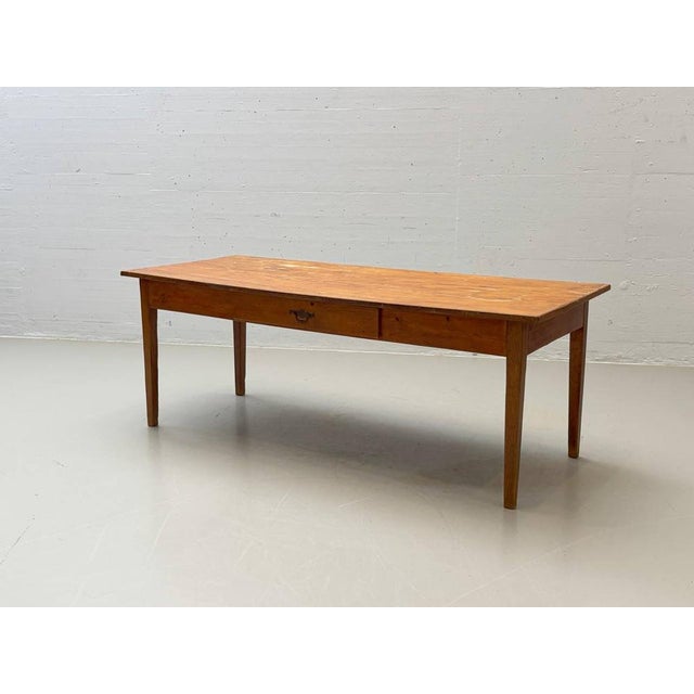 A simple, authentic wooden table with a rustic charm and a beautifully aged surface. Crafted from solid softwood, the...