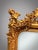 An absolutely stunning French-inspired panel mirror featuring a rich gilt wood and plaster frame with beveled glass. The...