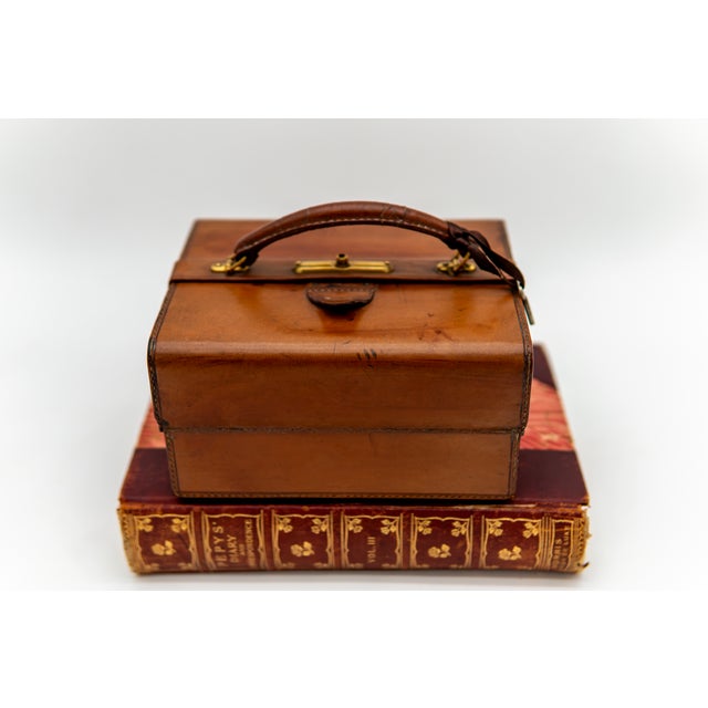 Antique 20th Century Victorian calf-leather jewellery case with a brass locking mechanism, key, and fittings, and...