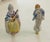 Lovely Victorian couple of musicians porcelain figurines in period clothing, mounted on brass bases as lamp finials.
