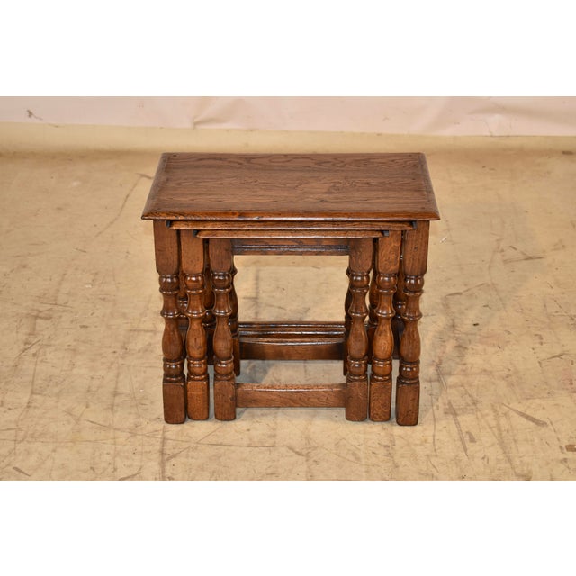 Nest of three English oak side tables, circa 1900. The large table measures 21.75 w x 13.5 d x 18.5 h, the medium table...