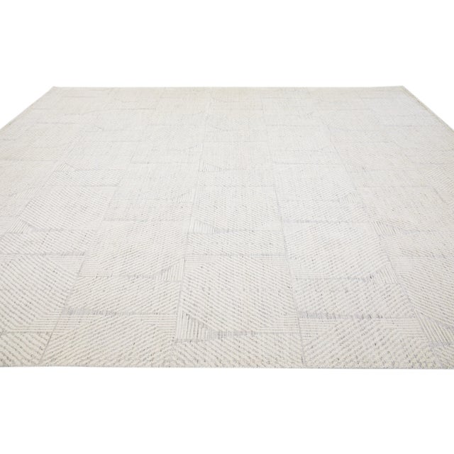Beautiful modern Moroccan-style hand-knotted wool rug with a beige color field. This rug is part of our Apadana's Safi...
