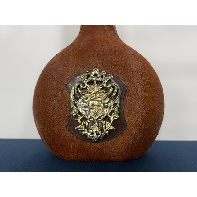 A striking vintage Italian decorative bottle wrapped in genuine hair-on-hide with its original matching stopper and an...
