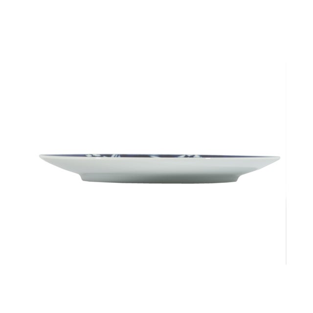 A Rosenthal Studio Line blue and white plate designed by the Danish artist and designer Bjørn Wiinblad (1918-2006)....
