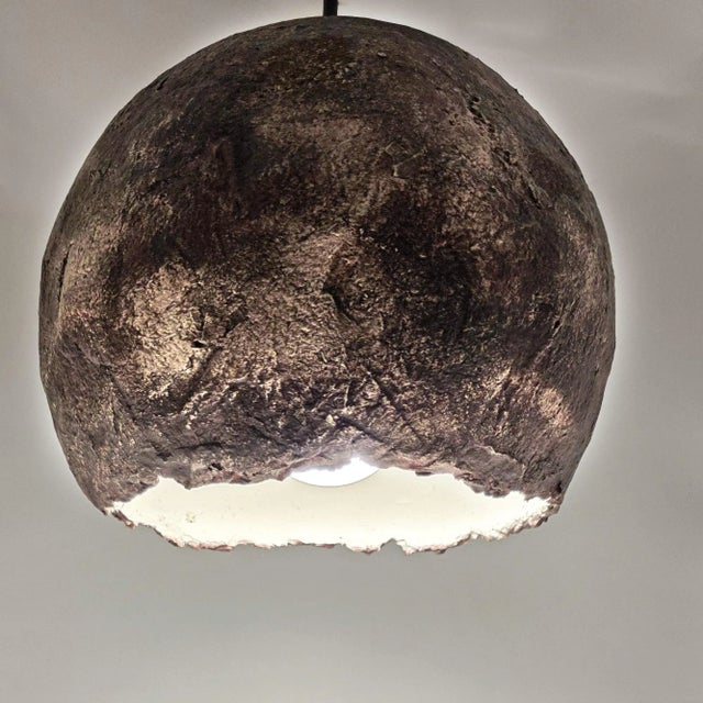 I'm Cecilio, and I'm a papier-mâché lamp made entirely by hand in Italy, using recycled paper and eco-friendly materials....