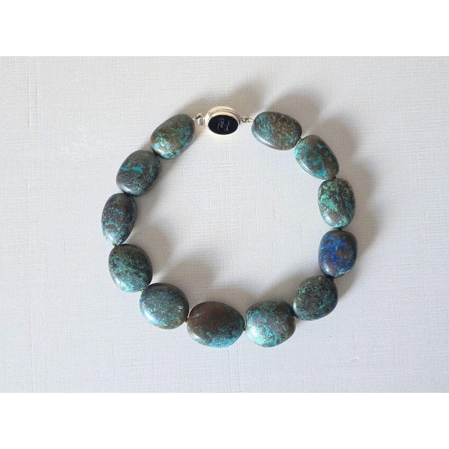 Discover an extraordinary vintage statement necklace featuring exceptionally large natural Arizona Chrysocolla beads....