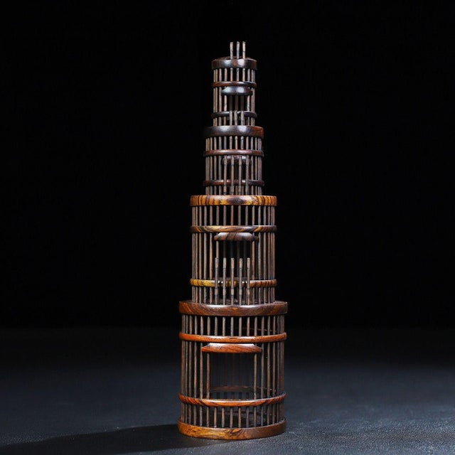 A beautifully crafted miniature Chinese cricket cage, likely made of Huali (rosewood). The piece is cylindrical, tapering...