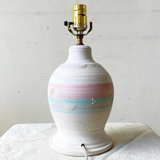 Exceptional postmodern sculpted pottery table lamp. Feasted a fantastic pink and green finish.