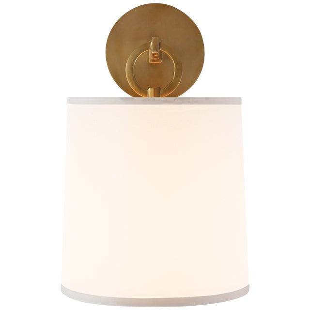 French Cuff Sconce in Soft Brass with Silk Shade Designer: Barbara Barry Height: 14" Extension: 8.75" Backplate: 4.75"...