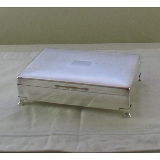 Description: Silver Wood Lined Cigarette Box , Guilloché. Pattern : Guilloché Size : 7 in. A Silver Cigarette Box...