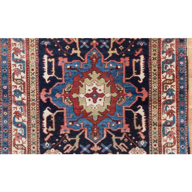 "This antique Heriz presents in an uncommon short-runner size — approximately 6'1" x 3'7" — a format rarely encountered in...