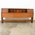 Restored walnut king size headboard by unknown American designer with multiple sliding doors and storage within. High...